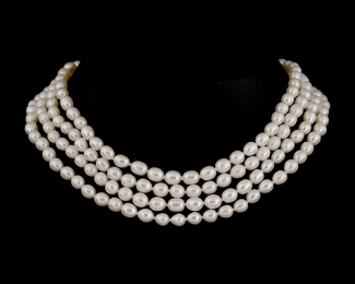 ^ Collar sin fin de 160cm. Perla oval blanca 6x7mm